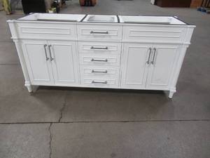 lot 106 image: 72 x 22 Vanity Cabinet in White. 4 center drawers, 2 cabinets with 4 doors and each with interior shelf. - Scratch and Dent LH Side.