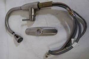 lot 610 image: American Standard Fairbury Single-Handle Pull-Down Sprayer Kitchen Faucet in Stainless Steel