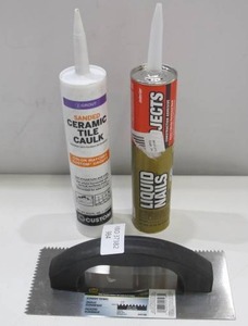 lot 984 image: 2 Caulk Bottles  Spreader