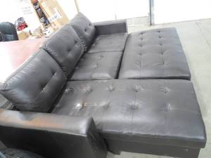 lot 111 image: Leather sectional sofa with ottoman