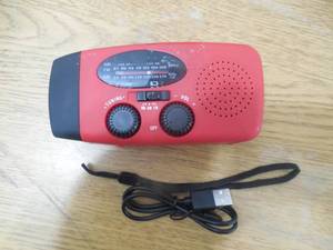 lot 89 image: SolarHand CrankUSB Emergency Weather Radio with Flashlight