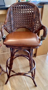 lot 12 image: Two Incredible Wicker and Leather Swivel Barstools