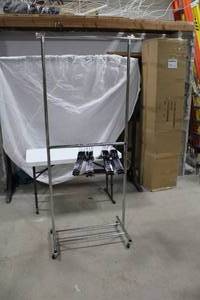 lot 580 image: Metal Rolling Clothes Rack 31Lx21Wx80H  with 25-Hangers