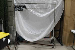 lot 680 image: Lot of (2) Metal Rolling Clothes Rack 60Lx24Wx68H  with 25-Hangers