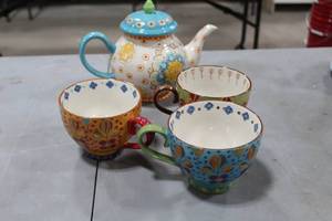 lot 731 image: Coastline Imports Handpainted Ceramic Dutch Wax Tea Pot  with Cups (x3)