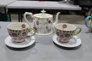 lot 732 image: Graces Teaware Ceramic Tea Pot  with Coastline Imports Dutch Wax Handpainted Cups (x2) and Saucers