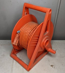 lot 68 image: Cord Storage Reel w Extension Cord