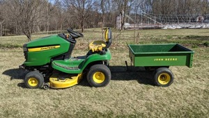 lot 1 image: John Deere X310 Lawn Tractor w Pull Behind Trailer Cart