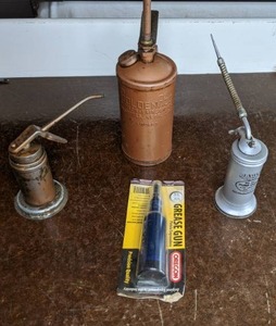 lot 306 image: Vintage Oil Cans & New Grease Gun