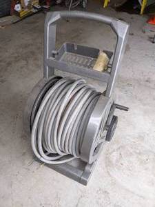 lot 105 image: Suncast Hose Reel & Garden Hose