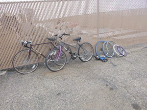 2 Adult Bicyclers and Parts