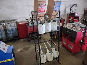 lot 88 image: Oil Dispenser Rack with Oil Cans...