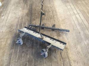 lot 41 image: Zero Turn Thatcher Attachment