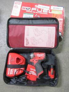 lot 21 image: M12 FUEL SURGE 12-Volt Lithium-Ion Brushless Cordless 14 in. Hex Impact Driver Compact Kit wOne 2.0Ah Battery, Charger and Bag., 2551-22. Used.