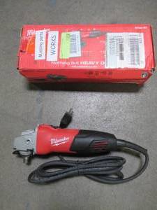 lot 28 image: Milwaukee 7 Amp Corded 4-12 in. Small Angle Grinder, 6130-3, Used. Missing Handle and Type 27 Guard.