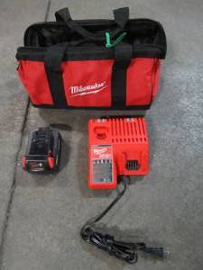 lot 38 image: Milwaukee M18 18-Volt Lithium-Ion 5.0Ah Battery, Charger and Bag. Used.