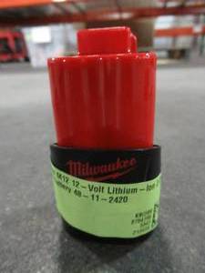 lot 44 image: Milwaukee M12 12-Volt Lithium-Ion 2.0 Ah Compact Battery 48-11-2420. Used.