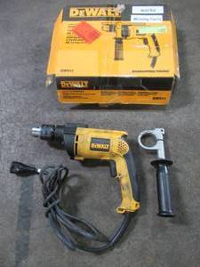 lot 59 image: DEWALT 12 in. Variable Speed Reversible Hammer Drill, DW511 - USED. Missing Depth Rod.