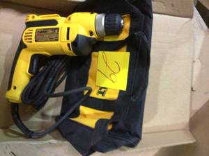 lot 29 image: 8 Amp Corded 38 in. Pistol Grip Drill by DEWALT Customer Returns See Pictures 