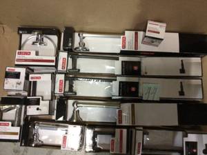 lot 44 image: Greenwich 4-Piece Bath Hardware Set in Polished Chrome by Delta Customer Returns See Pictures