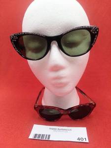 lot 401 image: Vintage 19650s Foster Grant Rhinestone Cat Eye Sunglasses & 1960s Cat Eye Sunglasses with Scallop Detailing (Valued$160)