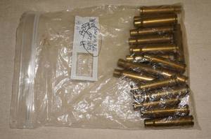 lot 58 image: 19 Empty 300 Win Mag Casings - Resized to .338 Win Mag
