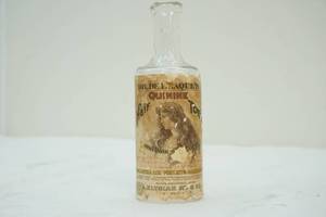 lot 201 image: Vintage Quinine tonic hair bottle