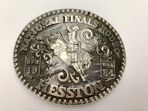lot 054 image: Vintage - Hesston Belt Buckles - National Rodeo Finals 1980  1984
