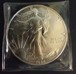 lot 20 image: 1986 American Silver Eagle - First Year
