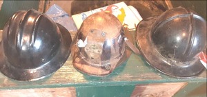 lot 139 image: (3) Vintage Helmets, One Skulgari Protective Helmet, One Hardboiled Helmet, One is Unmarked See Photos