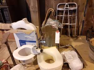 lot 159 image: Raised Toilet Seat With Arms in Box, Addtional Raised Seats, Canes, Oxygen Tubing in Packaging, Vintage Mirror, Vintage Bed Pan, Walker & More See Photos