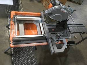 15 Amp Corded 12 in. Dual Bevel Sliding Miter Saw with 70 Deg. Miter Capacity by RIDGID used in good condition Customer Returns See Pictures
