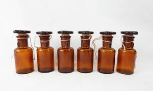 lot 127 image: Set of 6 Vintage Mercer Glass Works Merco 30 ML Amber Glass Flat Top Grooved Stopper Dropping Bottles