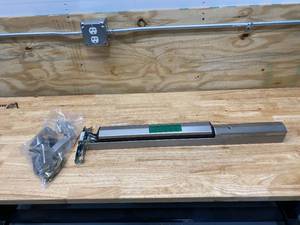 lot 11 image: YALE Rim Pullman Bolt, Exit Device, Stainless Steel, 7100, 30 in to 36 in Door Width.  Retails for $754.72