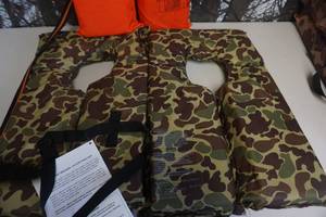 lot 131 image: Lot of 3 Life Jackets 2 Camo and 1 Orange