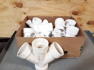 lot 516 image: NEW Box of 3 Sch40 Sanitary Double Wyes and More PVC Pipe Fittings