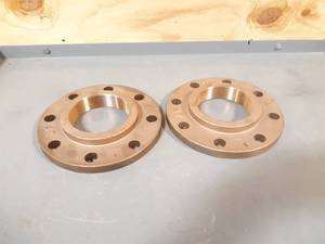 lot 495 image: NEW Pair of GHMC Brass 4 NPT 8-Bolt Pipe Flanges
