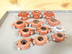 lot 541 image: NEW Lot of 12 Victaulic Pipe Clamps 1-14 to 2