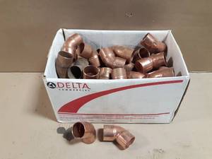 lot 672 image: Box of (54) 1-14 Copper 45° Elbows