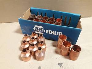 lot 687 image: Box of (18) 1-12 x 1-14 Copper Reducers & (9) 1-12 x 12 Copper Reducing Tees