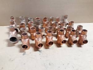lot 751 image: Lot of (30) Copper 1-12 Pipe Reducing Tees - Lot weighs about  15 LBS