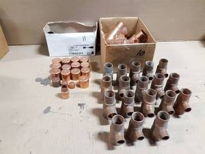 lot 758 image: Lot of (56) Copper 1 & 1-14 Reducing Tees & Caps - Lot weighs about  12 LBS