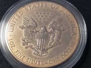 lot 76 image: 2013 GOLD PLATED AMERICAN SILVER EAGLE 1 TROY OZ. .999 FINE SILVER IN AIRTITE