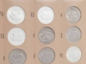 lot 25-A image: BOOK OF EISENHOWER DOLLARS INCLUDING SILVER & PROOFS