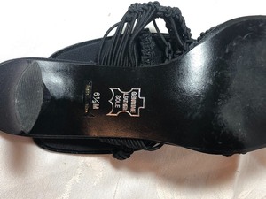 lot 76 image: Pair of black sandals