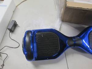lot 8 image: blue hoverboard powers on ...