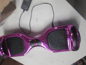 lot 28 image: pink hoverboard powers on ...