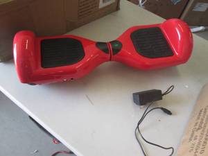 lot 43 image: red hoverboard powers on ...