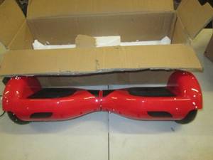 lot 159 image: red hoverboard powers on comes with...