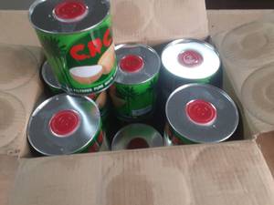 lot 128 image: Case of CPC Coconut oil cans, past date